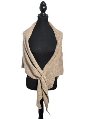 A light beige knit wrap or shawl draped over a black dress form mannequin against a plain white background.